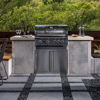 Protect hardscapes and built-in appliances by trimming nearby tree limbs that could fall during a storm.
